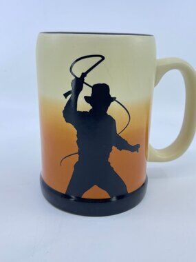 vintage disney indiana jones ceramic mug with whip silhouette and logo design